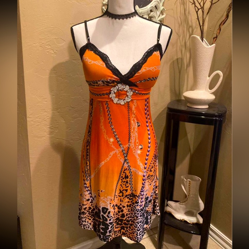Vibrant Orange V neckline with animal print pattern and spaghetti strap. Size S
